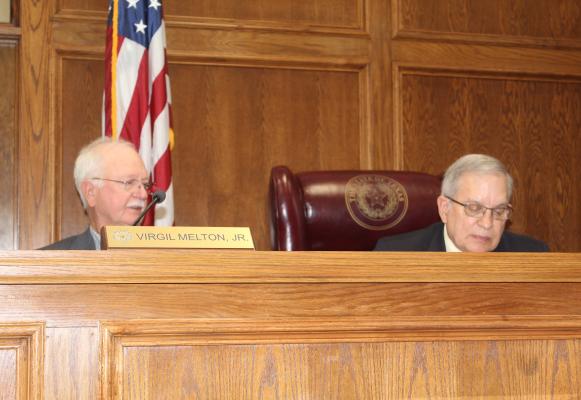 Van Zandt County Pct. 2 Commissioner Virgil Melton Jr., left, responds to a question from VZC Judge Andy Reese during a special called meeting Oct. 23 of the commissioners’ court. Photo by David Barber