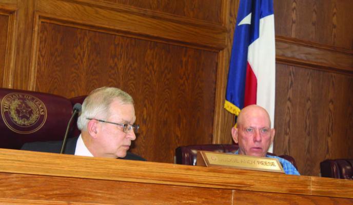 Van Zandt County Pct. 3 Commissioner Keith Pearson (right), discussed a six-month lease for two belly dump trailers from Brazos Trailers in VZC Pct. 3 during the regular meeting of the VZC Commissioners Court Aug. 2. Listening to Pearson’s comments was VZC Judge Andy Reese. The lease proposal was approved unanimously. Photo by David Barber