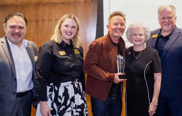 Grand Saline native and Christian recording artist Chris Tomlin (middle) was recently inducted into the Tyler Junior College Ovation Society. Pictured with Tomlin were left to right, Dr. Juan E. Mejia, TJC president and CEO; Miranda Sewell, TJC director of alumni relations; Dr. Cheryl Rogers, former TJC music professor and administrator; and Mitch Andrews, TJC vice president for institutional advancement. Photo by Francie Hodges