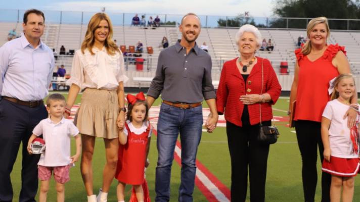 Rusty Gaston (middle), Van High School Class of 1994, was recognized by the Van ISD Education Foundation Sept. 24 as the 2021 VHS Distinguished Alumnus during pre-game Homecoming ceremonies at Van’s Memorial Stadium. Gaston is CEO of Sony Music Publishing Company in Nashville, Tennessee. Photo courtesy of the Van High School Journalism Department
