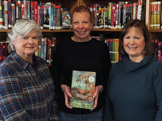 Grand Saline Friends of the Library President Catrennia Williamson and Vice-President Yvonne Trent presented a copy of ‘The Covenant of Water’ to Grand Saline Librarian Brandi Collard-Simpson (middle). The Grand Saline Friends of the Library are hoping to make a book donation