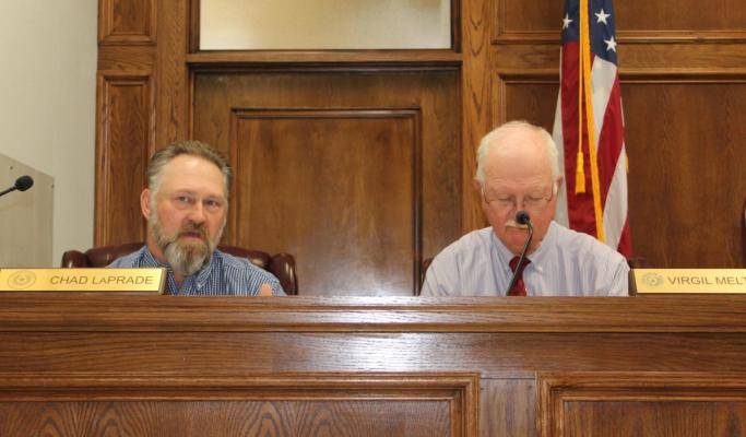 Van Zandt County Pct. 1 Commissioner Chad LaPrade (left) discussed lease agreements concerning belly dump trailers from Brazos Trailers for VZC Pct. 1 during the meeting of the VZC Commissioners Court. Also shown is VZC Pct. 2 Commissioner Virgil Melton Jr. Photo by David Barber