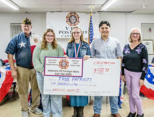 Veterans of Foreign Wars (VFW) 12219, Canton, recently announced the Voice of Democracy essay scholarship winners. Shown left to right were VFW 12219 Commander Dan Curtis; Elise O’Mara, Beth Jennings, Kevin Cervantes, and Voice of Democracy contest chair for the VFW Dayna Hoster. Photo by Faith Caughron