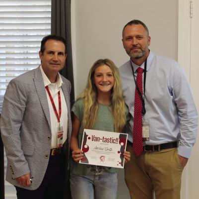 Van Junior High School eighth grade student Ansley Smith was presented a ‘Vantastic Award’ for her recent display of honesty and integrity on campus. The presentation was made during the regular monthly meeting of the Van School Board Sept. 16. Standing with the award recipient were Van ISD Superintendent Don Dunn (left) and VJH Principal Jeremy Whitten. Photo by David Barber