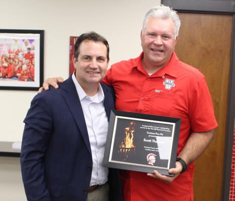 Outgoing Van School Board President Scott Thomas was presented with an appreciation plaque for his 12 years of service as a trustee. Presenting the plaque during the board’s regular monthly meeting May 15 was Van ISD Superintendent Don Dunn. Photo by David Barber