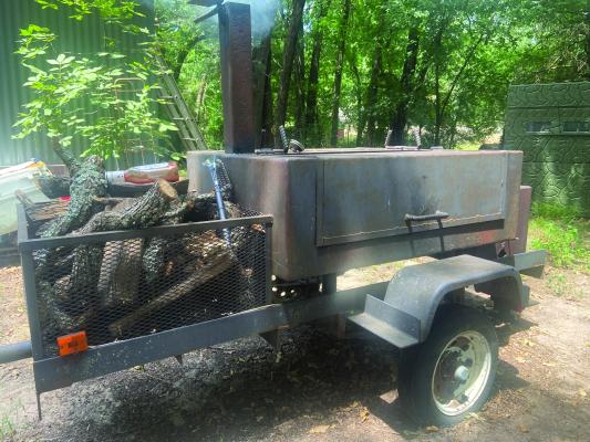 Luke gave his old smoker a try over the weekend but decided his electric smoker was much easier to work with and besides, it makes better barbeque. Photo by Luke Clayton