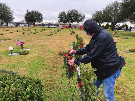 VZC Veterans placed wreaths at gravesites during National Wreaths Across America Day. Photo by Cheyanne Pennington