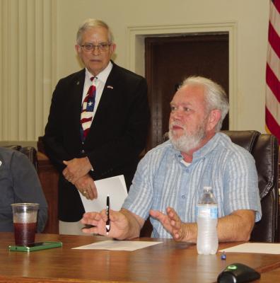 Van Zandt County Pct. 2 Commissioner Cliff Williams expressed his support for a resolution opposing the Grand Saline Creek Reservoir Project during a special called meeting of the VZC Commissioners Court Aug. 5. The meeting was held in the VZC District Courtroom with over 150 citizens in attendance. Also shown was VZC Judge Andy Reese. Photo by David Barber