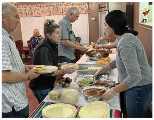 Owners and employees of The Red Bird Kitchen serve menu items to special guests before officially opening to the public Jan. 3. Courtesy photo