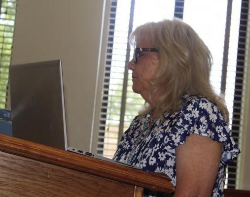 Van Zandt County Auditor Sandy Hill discussed a change order request from Woodrum Construction of Edgewood regarding road and bridge materials during the regular meeting of the VZC Commissioners Court July 5. The commissioners’ court approved the request in a 3-0 vote. Photo by David Barber
