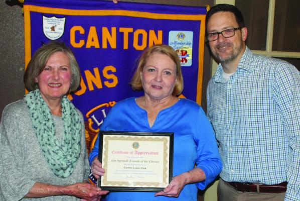 A ‘Certificate of Appreciation’ was presented to Van Zandt County Friends of the Library President Ann Spruiell, middle, following her guest speaking appearance March 26 at the weekly Canton Lions Club Luncheon held at Ole’ West Bean and Burger. Standing with Spruiell were Canton Lions Club President Jonathan Helvey and Canton Lions Club Member Sandra Giles Photo by David Barber