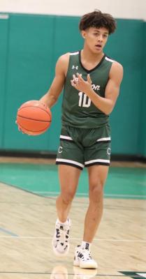 Chantson Prox directs traffic as he brings the ball into the front court during non-district play earlier this season. Photo by Lianna Reid