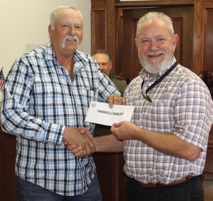Darrell Easley, left, was recognized for his 36 years of service as he is retiring as the Van Zandt County Pct. 2 foreman. Easley was presented to the VZC Commissioners Court during its special called meeting Oct. 31 by VZC Pct. 2 Commissioner Cliff Williams. Photo by David Barber