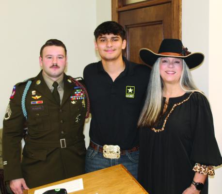 Chris Huss (middle), a success story in the Van Zandt County Youth Diversion Program, was introduced to the VZC Commissioners Court during its regular meeting Dec. 17 by VZC Youth Diversion Program Coordinator Jennifer Taylor. Also shown was U.S. Army Staff Sgt. Daniel Rogers. Photo by David Barber