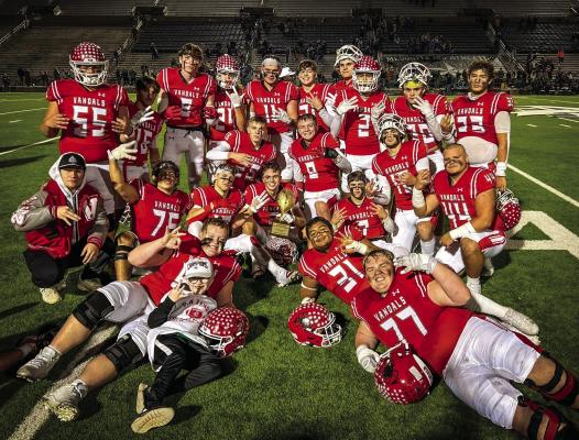 The Van Vandals proudly displayed their Class 4A, Division 2, Area Championship trophy Nov. 22 after defeating the Van Alstyne Panthers, 45-42, at Mesquite Memorial Stadium. The Vandals faced Sunnyvale Nov. 29 in the Class 4A, Division 2, Regional Semifinals in Mesquite. Photo by Liz Hinch/Hi5 Photography