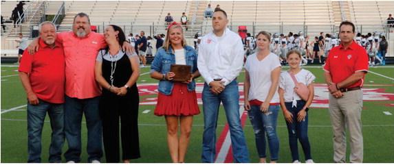Chad Yarbrough, Van High School Class of 1997, (center in white shirt), was recognized by the Van ISD Educational Foundation as the 2023 ‘Distinguished Alumnus’ Sept. 15 prior to the kickoff of the Homecoming football game between the Van Vandals and the Paris Wildcats. Yarbrough is currently the Special Agent in Charge of the Dallas Field Office for the FBI (Federal Bureau of Investigation).