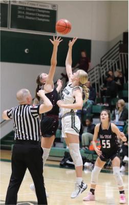 The Martins Mill Lady Mustangs (dark uniforms) and the Canton Eaglettes renewed their Van Zandt County rivalry on the basketball court Dec. 5 in Canton. The Lady Mustangs defeated the Eaglettes, 46-31. The Lady Mustangs participated in the Great East Texas Shootout Tournament in Brownsboro Dec. 7-9. Canton visited Lufkin Dec. 8 and will Lindale in their district opener Dec. 12. Photos by Lianna Reid