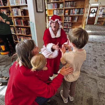 Mrs. Santa Claus delivered books, and stuffed toy sets to children at the Grand Saline Public Library recently. The event was a project of the Grand Saline Friends of the Library. Mrs. Claus (GS Friends of the Library President Catrennia Williamson) was accompanied by her elf, GS Friends of the Library Vice-President Yvonne Trent. Courtesy photo