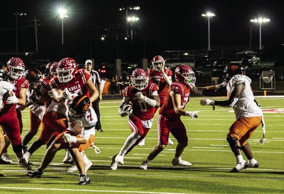 Van Vandal running back Da’Quavion Williams (0) races up the middle on a touchdown run Oct. 17 against the Gilmer Buckeyes. Williams finished with 197 yards rushing on 27 carries and three touchdowns as the Vandals registered an important 48-38 district victory at home. Van played at Pittsburg Oct. 23, a day earlier than scheduled, due to anticipated inclement weather moving in. Photo by Jillian Veader, V8R Photography