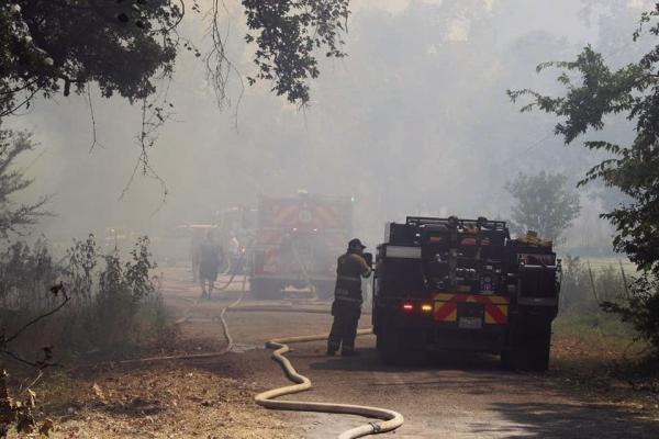 The Myrtle Springs Volunteer Fire Department, with assistance from several other fire departments, responded to a large brush fire at 2:55 p.m. Aug. 20 on VZCR’s 3440 and 3441. Other fire departments assisting the MSVFD included Wills Point, Canton, Edgewood, and South Van Zandt as well as the Canton Police Department. The temperature at the time of the brush fire was 105 degrees with a heat index of 112. Photo by Nick Gibbons