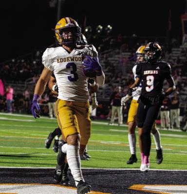 Edgewood Bulldog running back Lucas Pippin (5) celebrates a touchdown he scored on a running play Oct. 10 against the Grand Saline Indians. Pippin had 108 yards rushing on eight carries and three TD’s as the Bulldogs outlasted the Indians, 45-28, in a battle of Van Zandt County rivals. Photo by Dusty Goodwin
