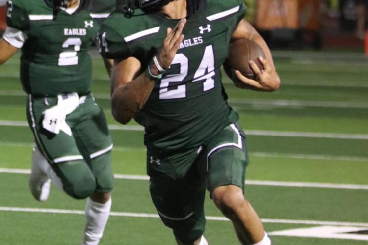 Right, Juan Robles logged 23 rushes for 154 yards and two touchdowns in Canton’s 24-21 come-from-behind win over Mineola. Photo by Lianna Reid