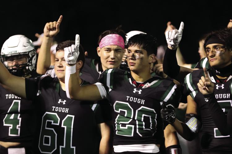 Following an emotional ‘Senior Night’victory over the Brownsboro Bears Oct. 20, the Canton Eagles listened to the playing of the school song. Among those standing at attention were Logan Faglie (4), Mike Vasquez (61), Collin Campuzano (20), and Noe Mendieta (7). The Eagles enjoyed an open date before traveling to Rusk for their final regular season game Nov. 3. Photo by Lianna Reid
