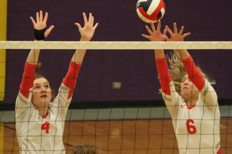 Ashlyn Lloyd (4) and Maci Jones (6) went sky high above the net to slow a Blue Ridge kill attempt Aug. 28. Van would go on to win the match in three sets. Photo by David Kapitan