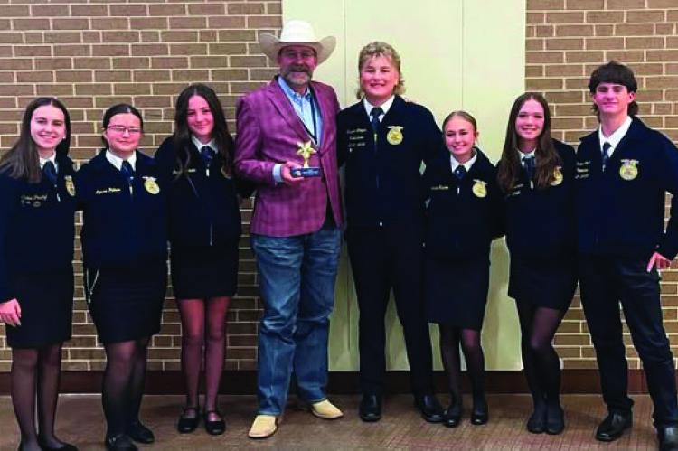 Wills Point ISD Superintendent Richard Cooper was recognized as the Area VI Star Administrator recently during the 98th Texas FFA State Convention. The Area Star Administrator Award is presented to school administrators who go above and beyond in supporting agricultural education and FFA. Cooper is shown with members of the Wills Point FFA Chapter. Courtesy photo