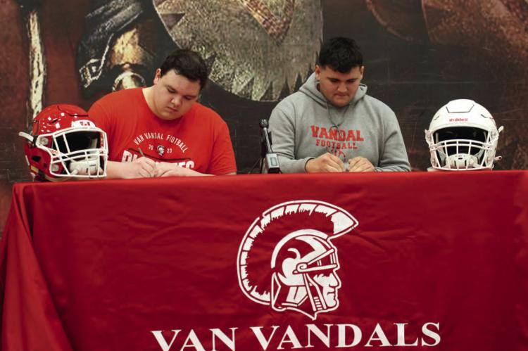 Van Vandal offensive linemen Ace Bostick and Jose Suarez signed National Letters of Intent to play college football at Blinn Junior College. The signing ceremony was held Feb. 7 at the Van High School Cafetorium. Photo courtesy of the Van High School Journalism Department