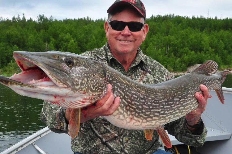 Fishing on a wilderness lake in Canada is something every avid angler should experience at least once. Luke shows off a big northern pike he landed in northern Saskatchewan. Photo by Luke Clayton