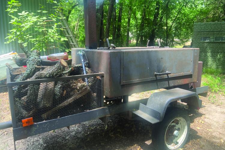 Luke gave his old smoker a try over the weekend but decided his electric smoker was much easier to work with and besides, it makes better barbeque. Photo by Luke Clayton