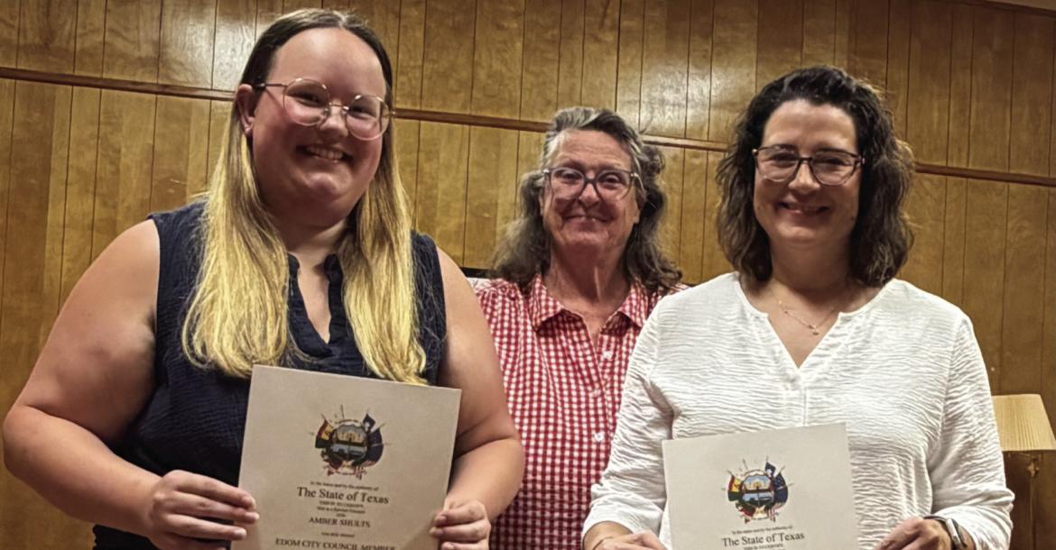 Amber Shults (far left) and Jammie Thedford (far right) were sworn in as members of the Edom City Council July 9 during the regular monthly meeting of the council. Standing with the sworn-in council members was Edom Mayor Barbara Crow. Courtesy photo