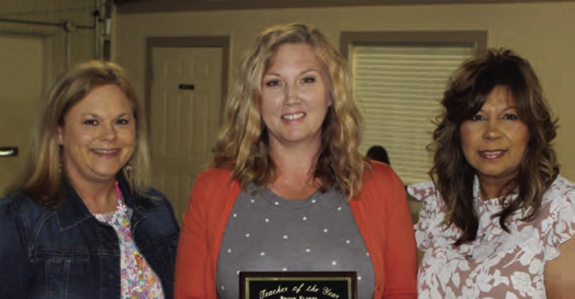Brooke Flores (middle) was named as the Grand Saline Elementary School ‘Teacher of the Year.’ Presenting the award were Grand Saline Elementary School Principal Lori Hooten (left) and Grand Saline Chamber of Commerce Director Mary Corrales.